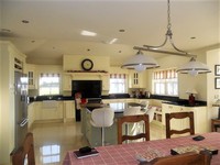 Grisvert island and cream kitchen in a Traditional Style Kitchen.